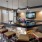 a bar with stools and a tv