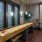 a room with a table and chairs and shuffleboard